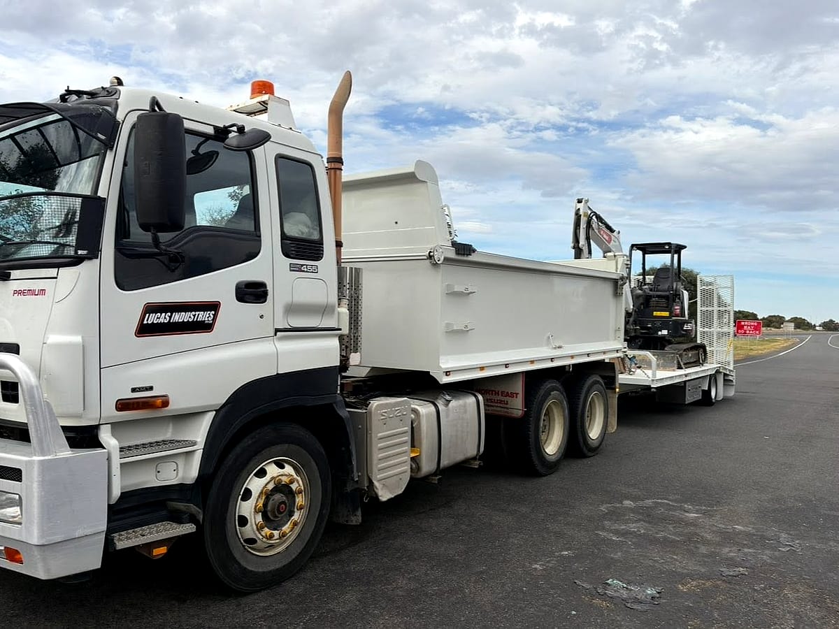 Tipper truck and plant on a Lucas Industries job site